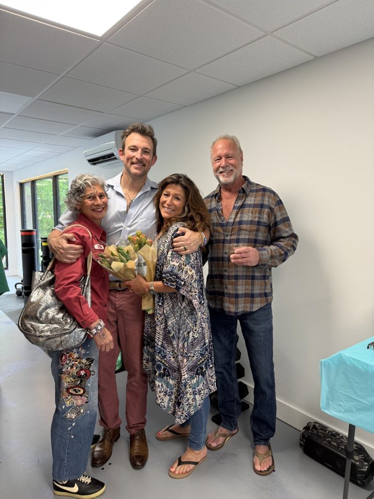 Garret McCann with his mother and family friends at the Quantic Wellness Collective Grand Opening