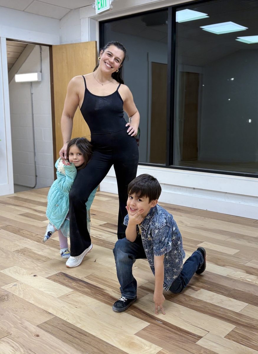 Mapa Laverde, co-founder of Quantic Wellness Collective, with her two children inside the Asheville studio